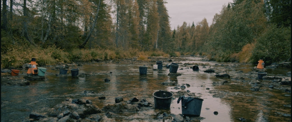 Plastic buckets in a river.