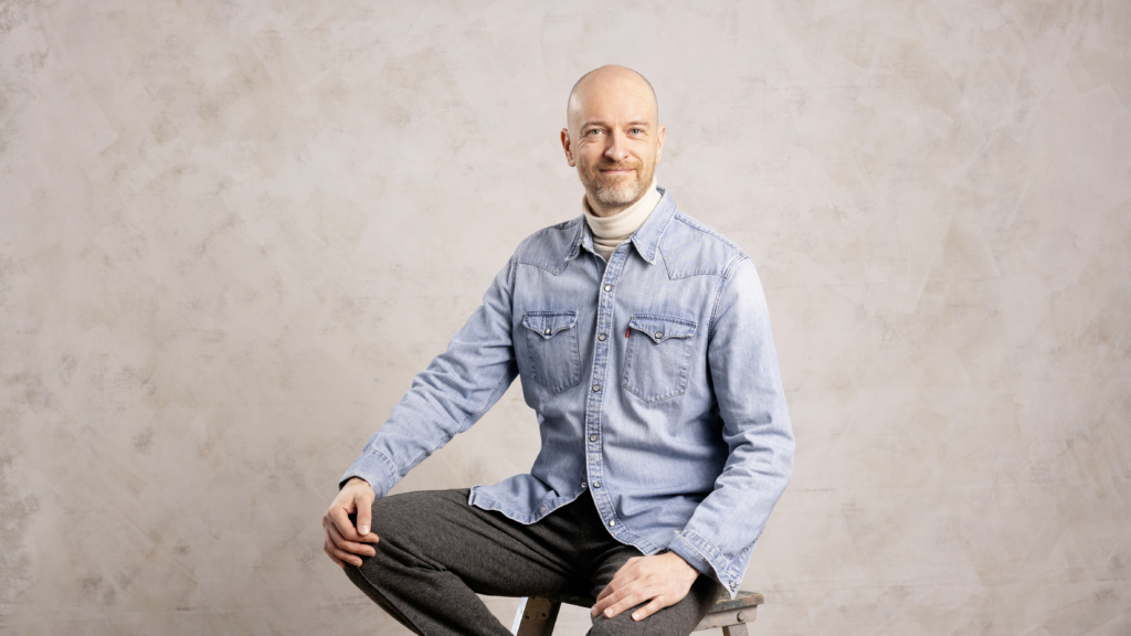Hannu Karjalainen sitting on a chair