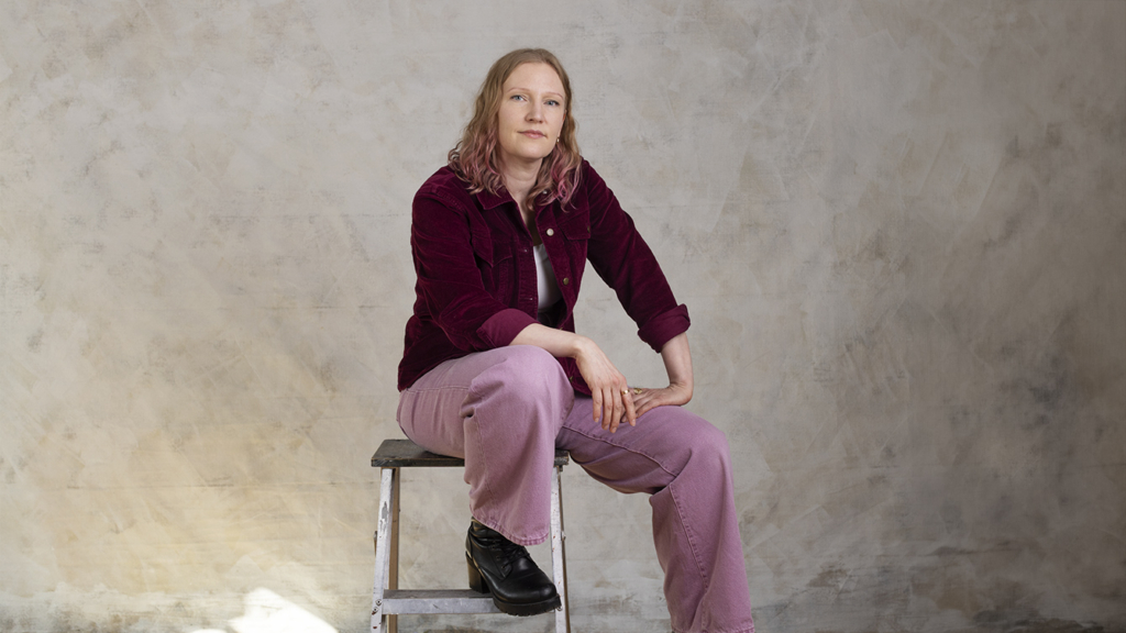 Jonnakaisa Risto sitting on a stool.